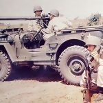 Antique military machinery and jeep