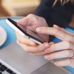 girl on mobile phone at online checkout