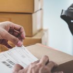 Home delivery service and working service mind, Woman working install serial barcode to confirm before sending customer in post office.